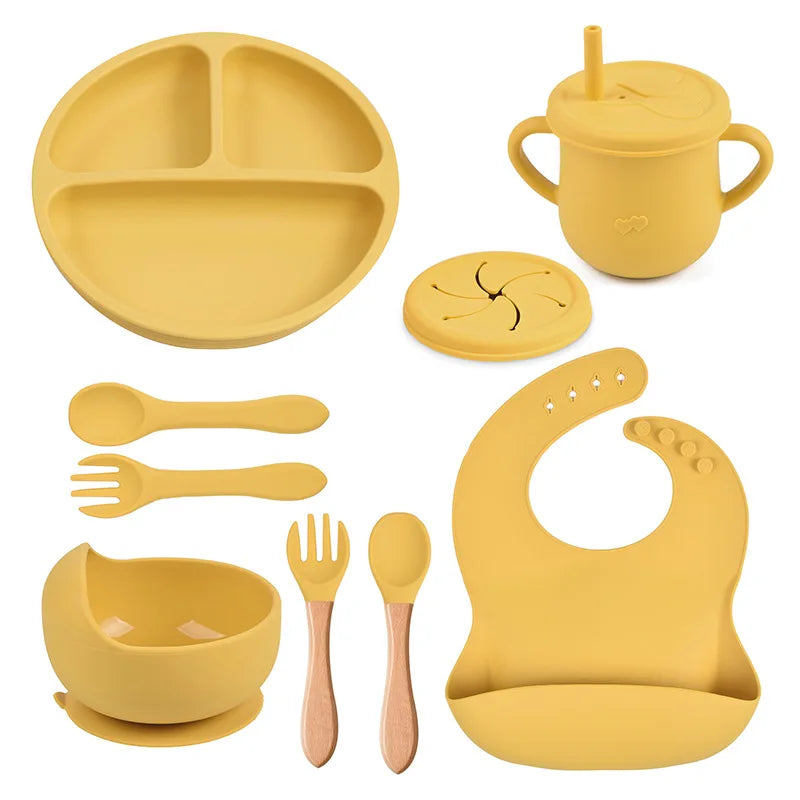 Set repas bébé 9 pièces – Assiette sourire, bol, tasse, bavoir, cuillère et fourchette bois | Silicone sans BPA