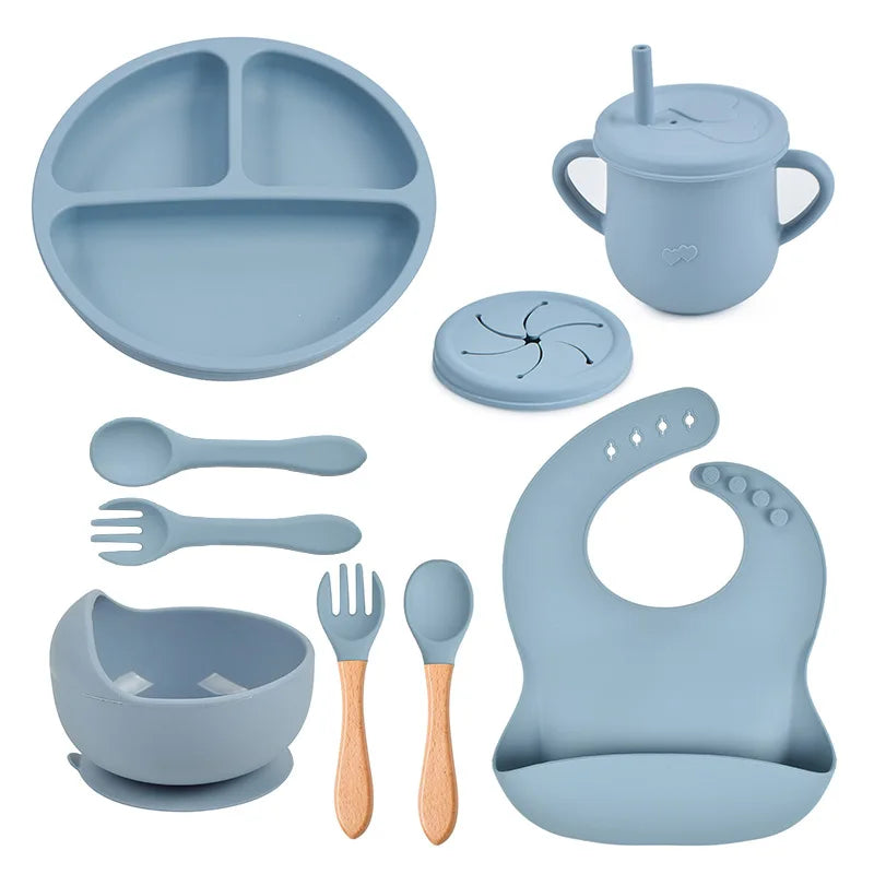 Set repas bébé 9 pièces – Assiette sourire, bol, tasse, bavoir, cuillère et fourchette bois | Silicone sans BPA